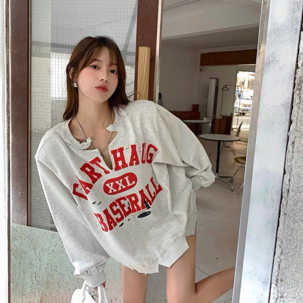 Ripped baseball sweater